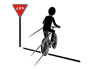「止まれ」の標識がある交差点で一時停止せずに通過している自転車のシルエットイラスト