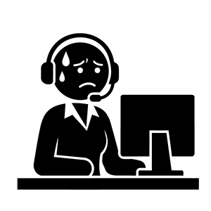 パソコンの前でヘッドセットをつけて困っているオペレーターの女性